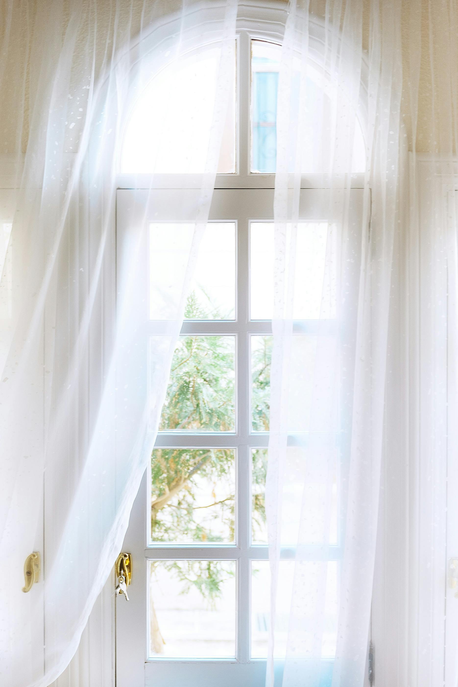 Serene window with flowing curtains — life on the other side of the shift